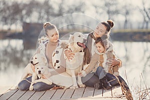 Happy family with Pets near the lake