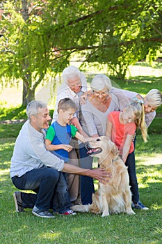 Happy family petting their dog