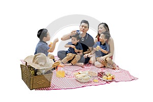 Happy family picnicking with bubble soap
