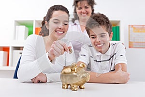 Happy family with piggybank