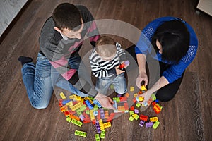 Happy family play with cubes