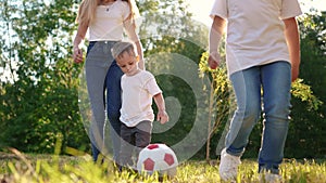 Happy family play a soccer in the park. Group of children in nature playing ball silhouette park. Happy family kid dream
