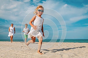 happy family play on tropical beach vacation