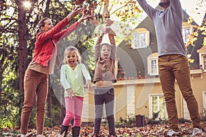 Happy family playing at backyard. On the move.