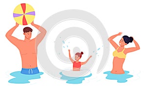 Happy family playing beach ball in water together