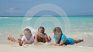 Happy family playing on the beach at the day time