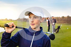 Happy family is playing golf in autumn