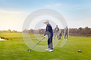 Happy family is playing golf in autumn