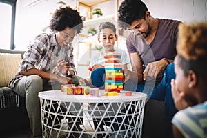 Happy family playing and having fun together at home.