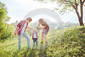 Happy Family Playing on the Nature