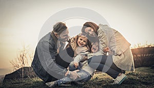 Happy family playing outdoor. Family enjoying together in nature