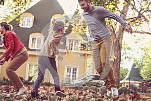 Happy family playing outside. On the move.