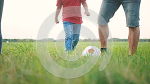 happy family playing soccer with ball in the park. children playing football in the park. happy family a kid dream