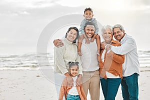Happy family, portrait and beach with grand parents, parent love and kids together by sea. Outdoor, vacation and