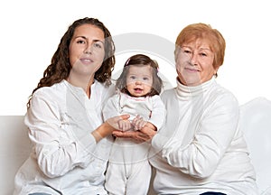 Happy family portrait - grandmother, daughter and granddaughter