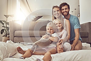 Happy family, portrait and hug on living room floor for weekend, holiday or relax together at home. Mother, father and