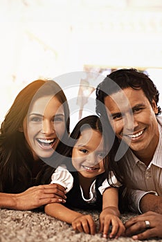 Happy family, portrait and hug with support for love, bonding or relax together at home. Face of mother, father and