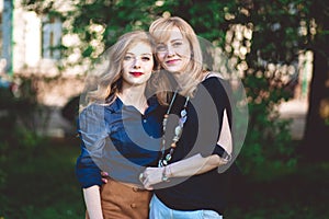 Happy family portrait. Mother and daughter hugging