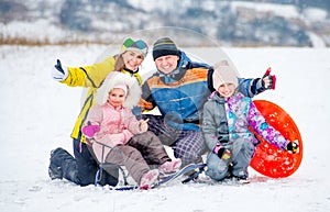 Happy family portrait outdoors at winter time