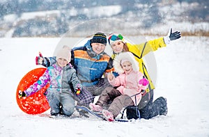 Happy family portrait outdoors at winter time