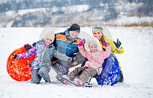 Happy family portrait outdoors at winter time