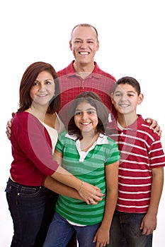 Happy family portrait smiling together - isolated on white background.