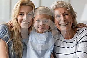 Happy family portrait of three generations of women