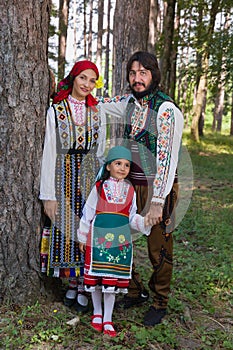 Happy family posing in Bulgarian costume