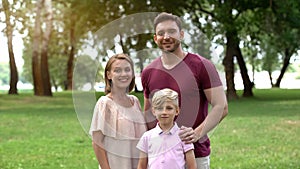 Happy family posing for camera, concept of secure life, togetherness and support