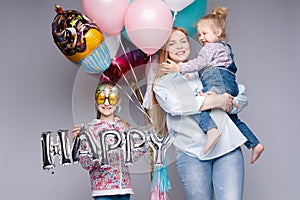 Happy family posing while celebrating birthday party