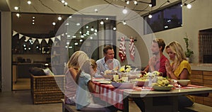 Happy family praying before dinner