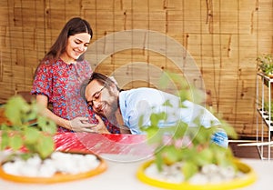 Happy family with pregnant woman