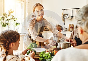 Happy family preparing healthy lunch together photo