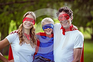 Happy family pretending to be superhero