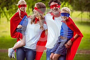 Happy family pretending to be superhero