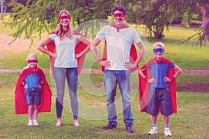 Happy family pretending to be superhero