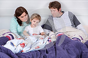 Happy family reading book