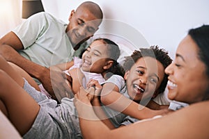 Happy family, relax and playing in bed with smile for free time, weekend or fun holiday morning at home. Mother, father