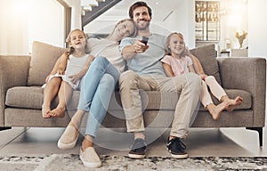 Happy family, relax and watching tv on living room sofa for entertainment or bonding together at home. Mother, father