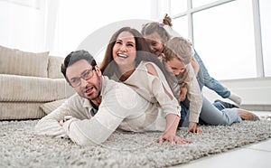 Happy family relaxing in comfortable living room