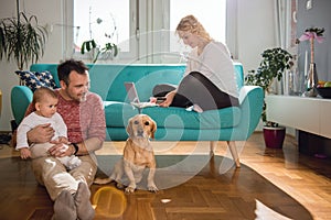 Happy family relaxing at home