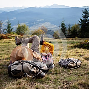 Happy family resting in the mountains in autumn