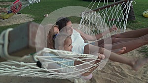 Happy family rides emotionally on hammock stock footage video