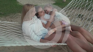 Happy family rides emotionally on hammock stock footage video