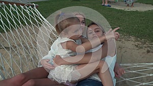 Happy family rides emotionally on hammock stock footage video