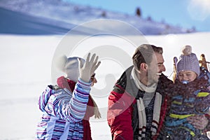 The happy family rides the sledge in the winter wood, cheerful winter entertainments