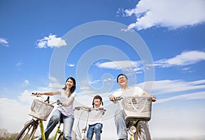 Happy family riding bicycle