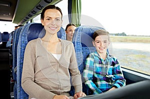 Happy family riding in travel bus