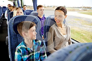 Happy family riding in travel bus