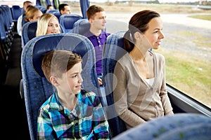 Happy family riding in travel bus